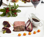 Seared venison with poached pear and beetroot puree